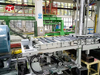 Steel wire compression and wrapping machine
